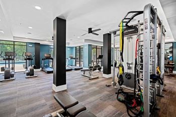 Cardio and strength training fitness center with peloton bike and lifefitness equipment